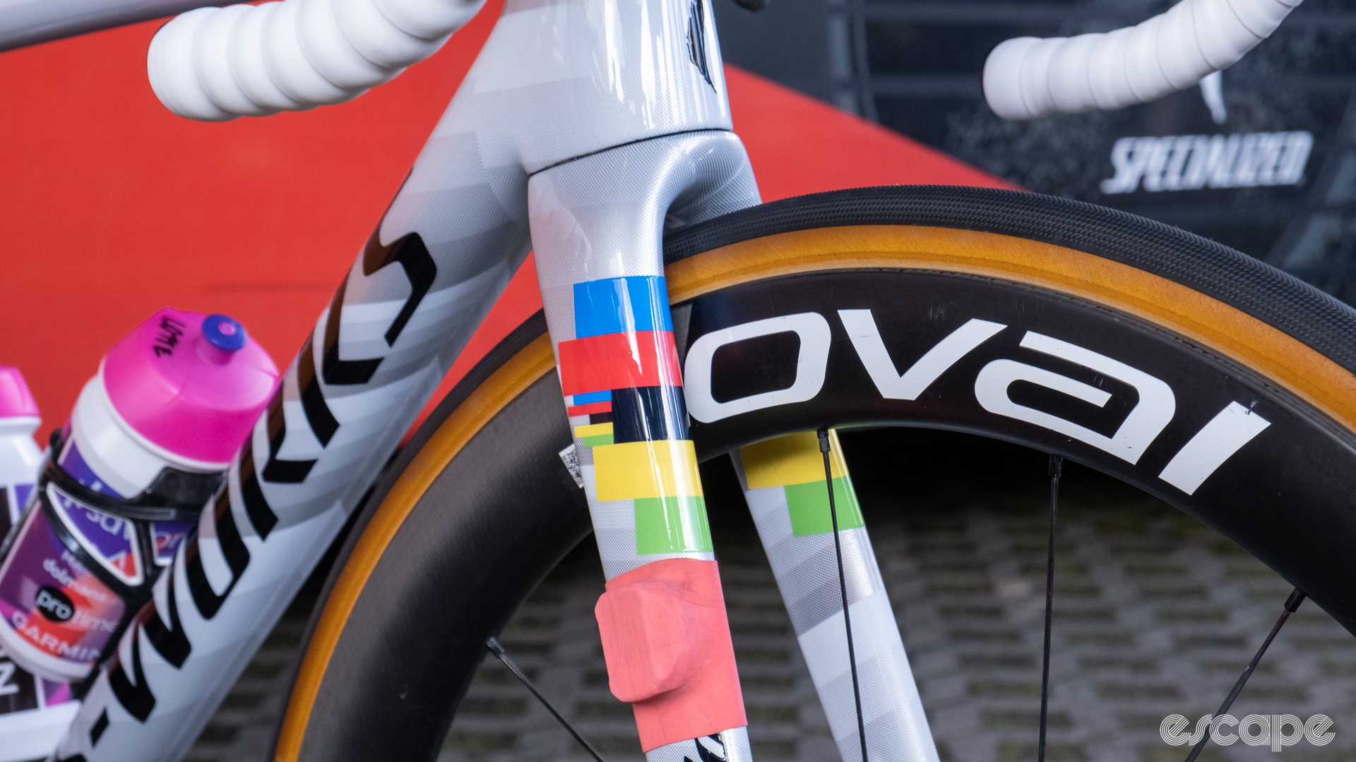 The image shows Kopecky's forks with a rainbow band decal and a timing chip held in place with a latex tube. Kopecky is also using Roval wheels as seen in the photo.