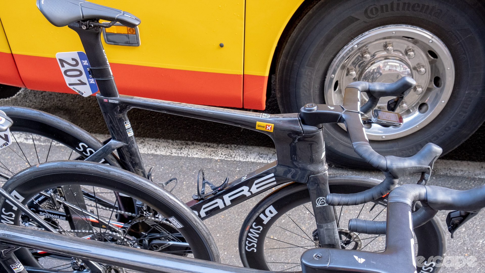 The image shows Alexander Kristoff's new Dare prototype aero bike on a bike rack with some existing Dare bikes outside the Uno X team bus. 