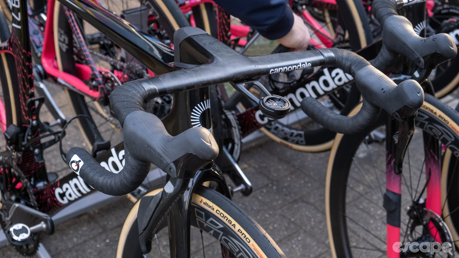 The image shows Alberto Bettiol's handlebars from the front.