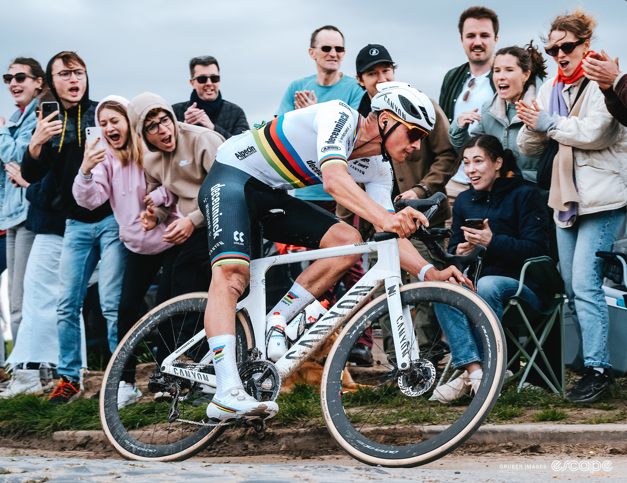 Well behaved (as far as we know) fans cheer on Mathieu van der Poel from the side of the road on Sunday at Paris-Roubaix.