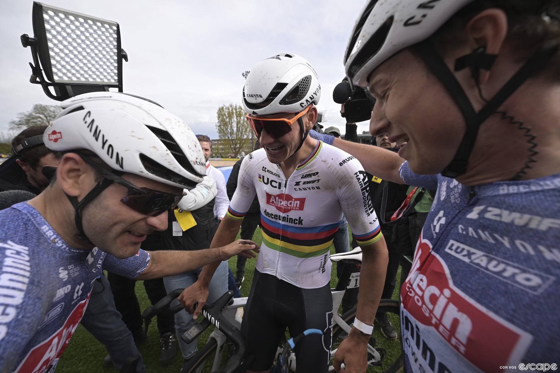 Gianni Vermeersch, Mathieu van der Poel, and Jasper Philipsen after Paris-Roubaix.