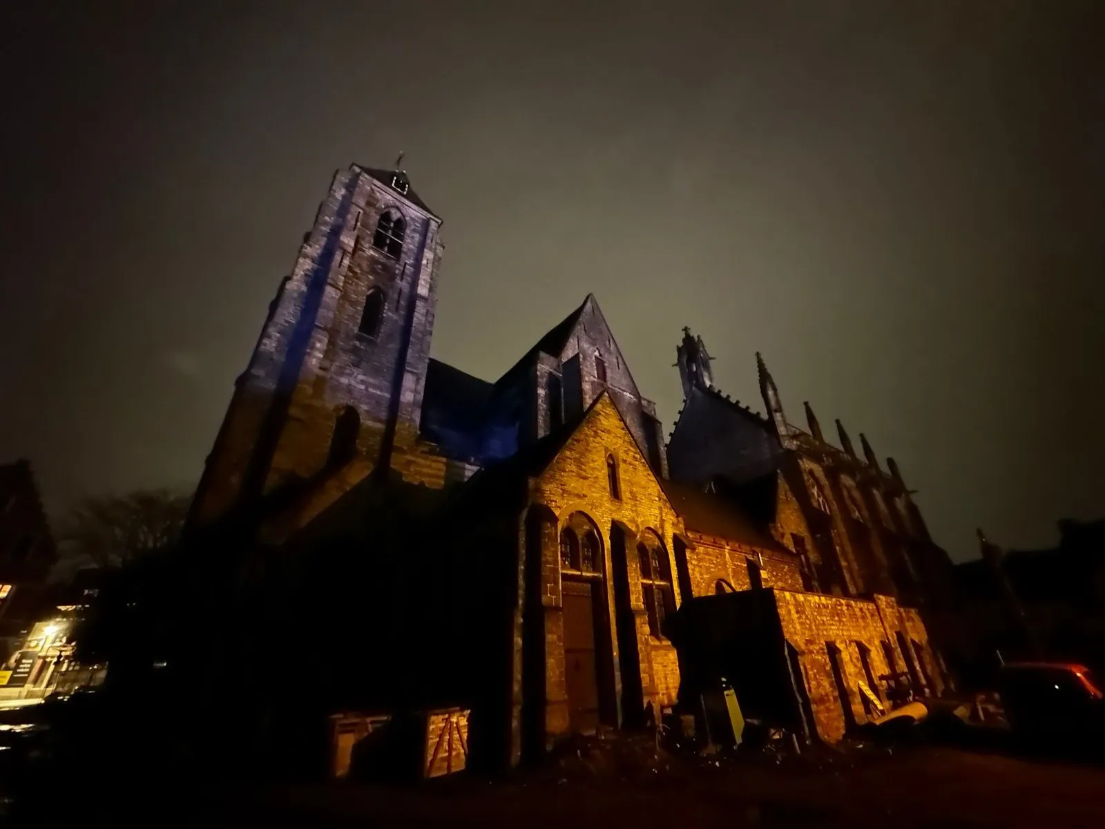 A gothic cathedral illuminated at night 