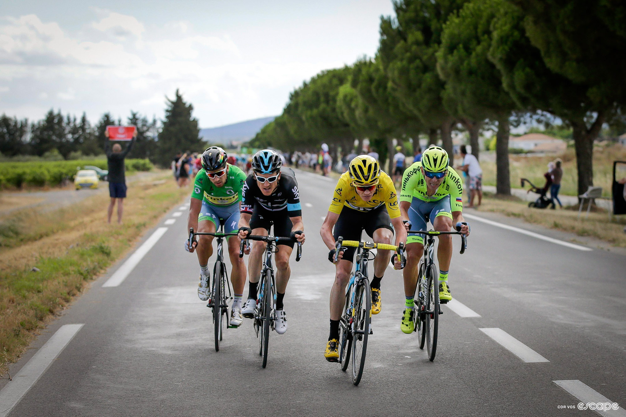Chris Froome, in the yellow jersey of Tour de France leader, is at the front of a quartet of riders in a late-race break. Geraint Thomas is on his wheel as the two GC contenders try to get time, while Peter Sagan sits behind with a mildly amused expression, and his teammate Maciej Bodnar split to the right.
