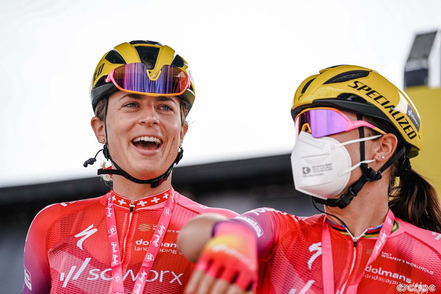 Reusser laughs with a teammate before a stage of the Tour