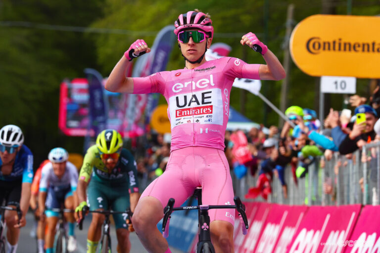 Tadej Pogačar celebrates stage 8 victory in the pink jersey of Giro d'Italia leader.