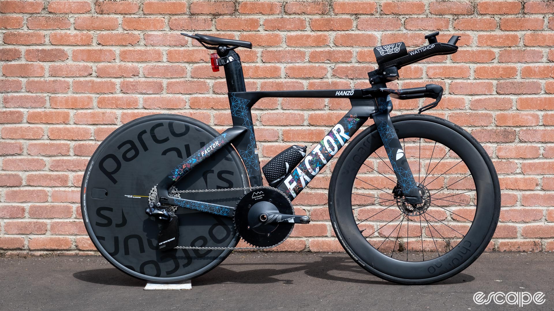The image shows a Factor Hanzo TT bike with Parcours wheels