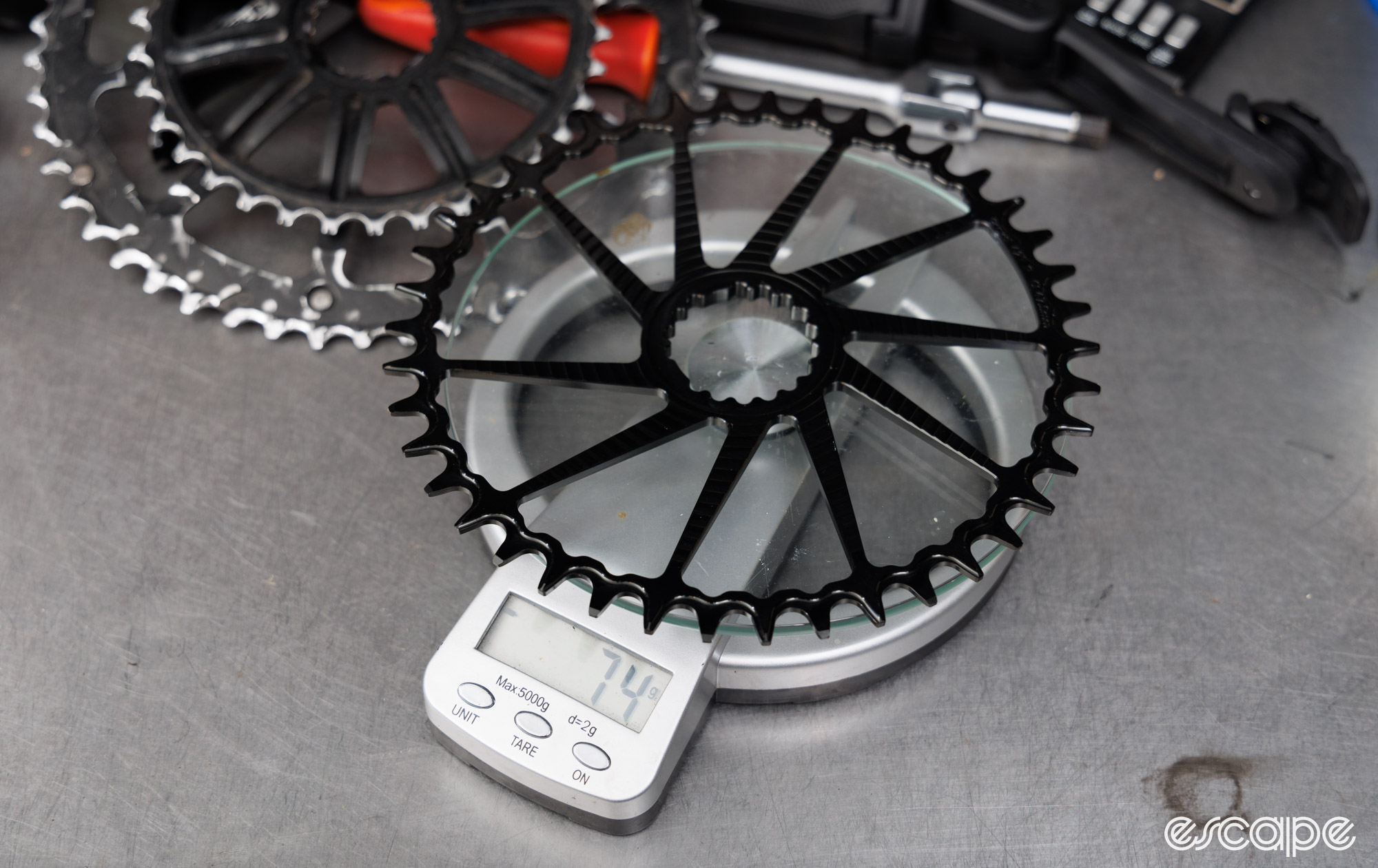 42T Garbaruk DM round chainring on a scale that reads 74 grams. 