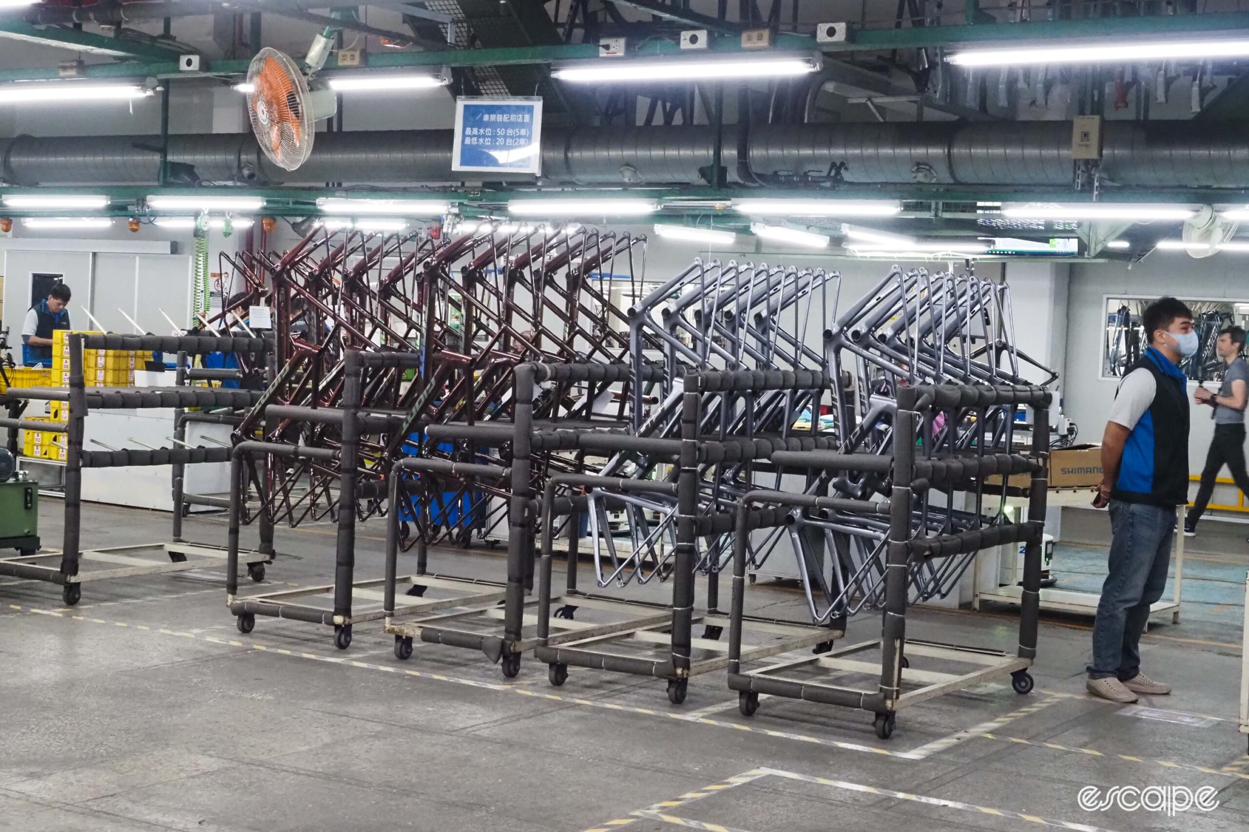 Giant carbon factory tour finished frames on rack