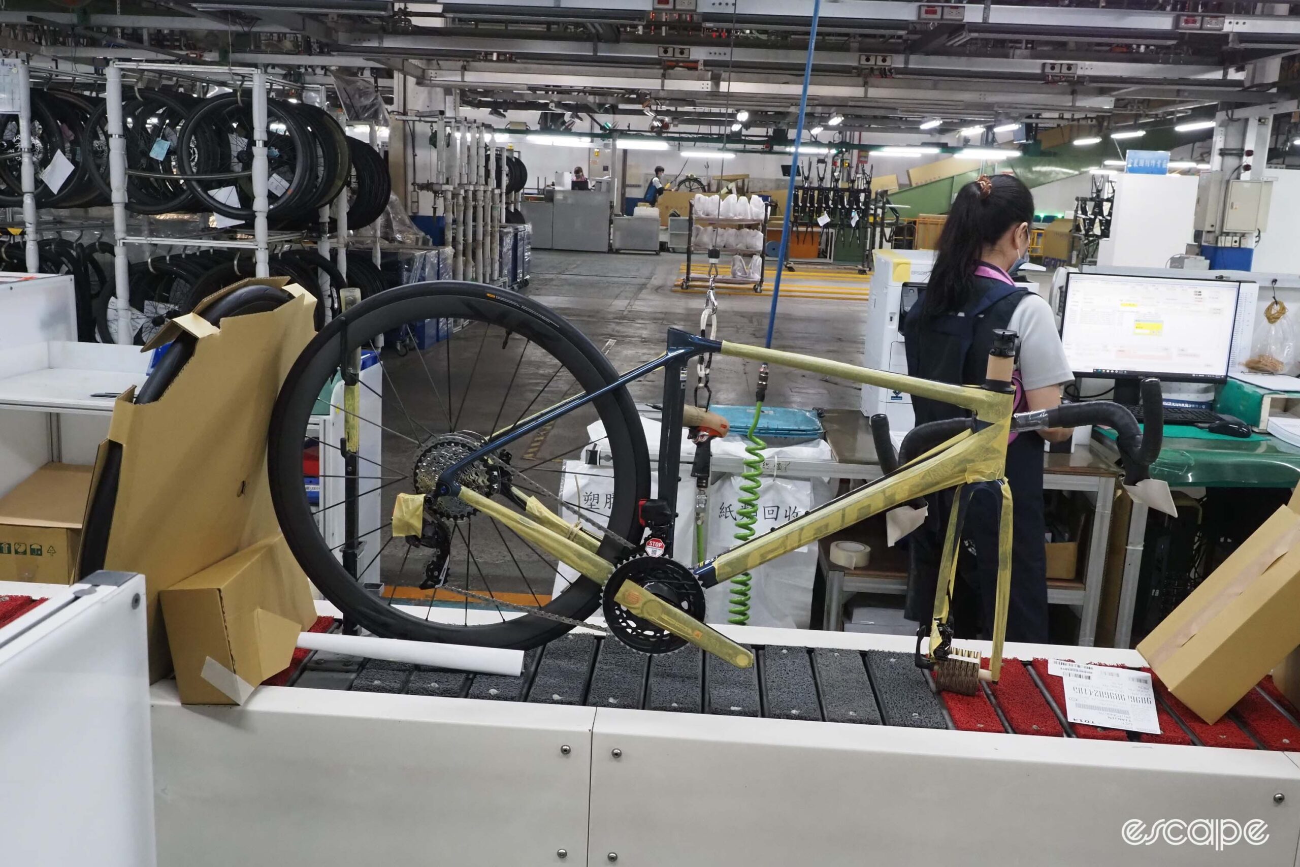Giant carbon factory tour built bike on conveyor