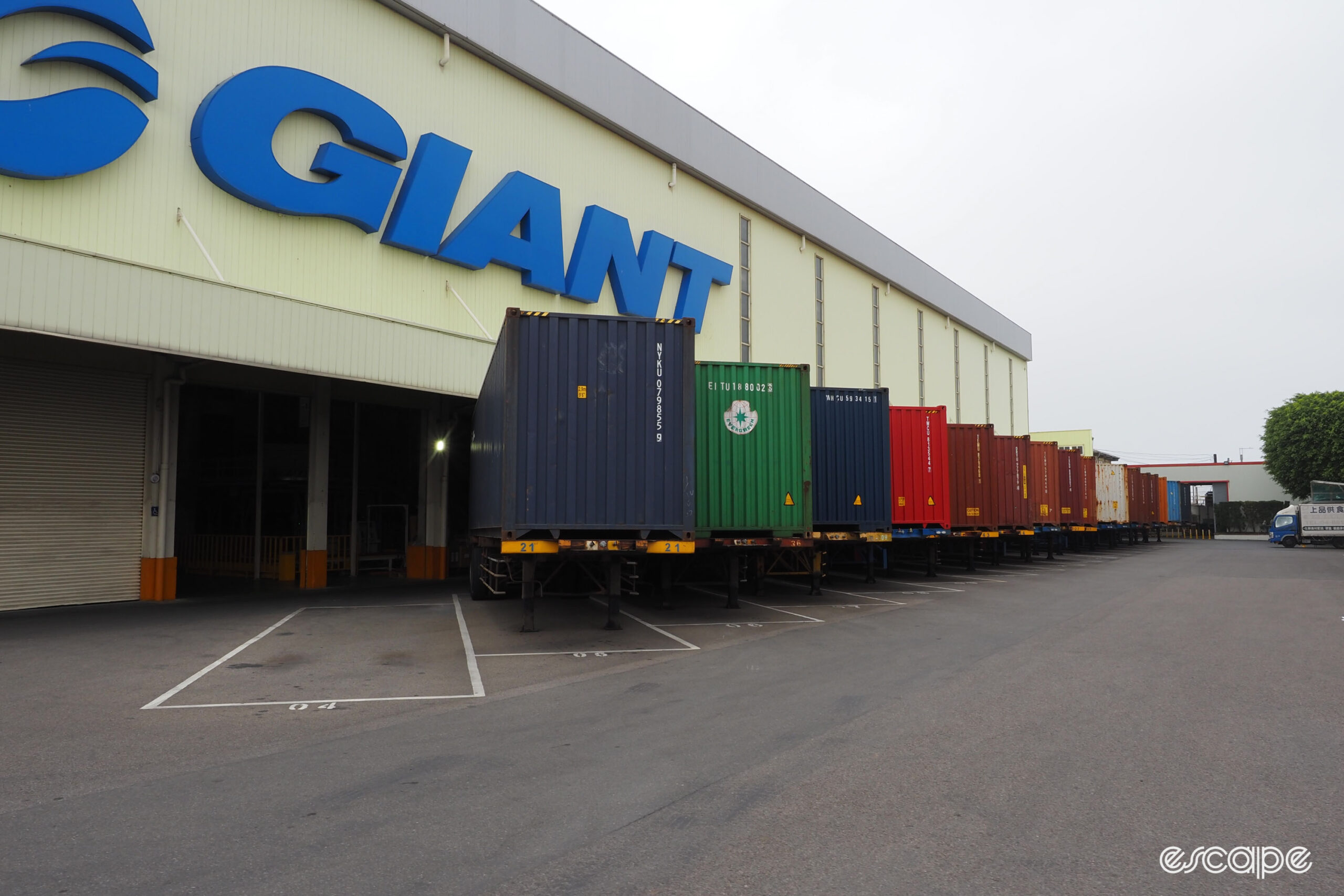 Giant carbon factory tour shipping containers