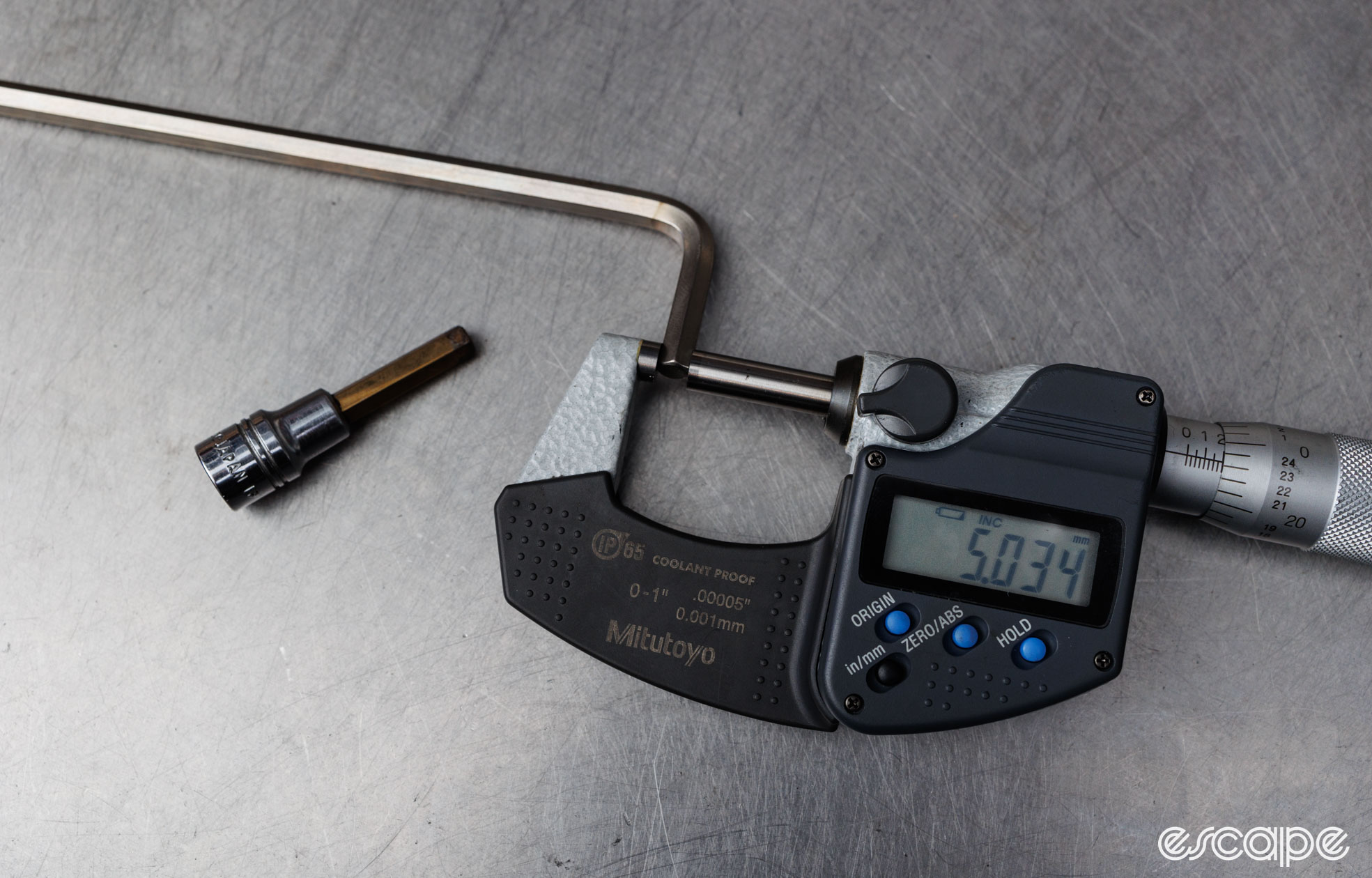 A micrometre measures a 5 mm Bondhus BriteGuard hex key at 5.034 mm. 