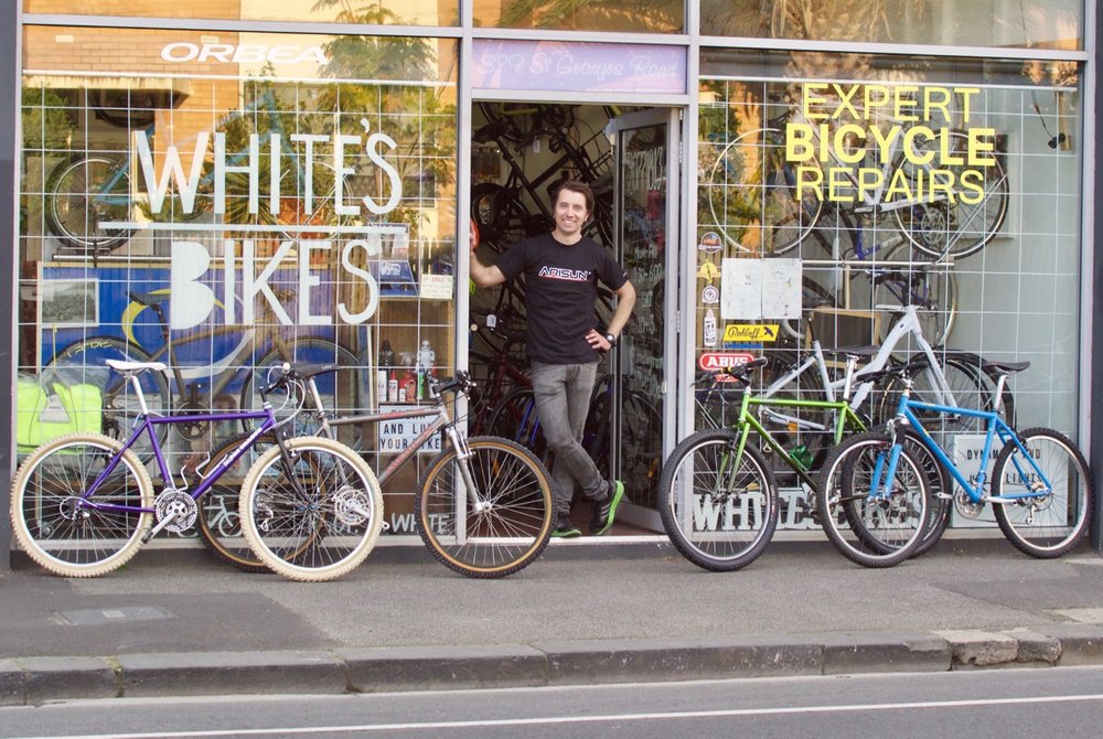 Steve White poses in the doorway of White's Bikes. 