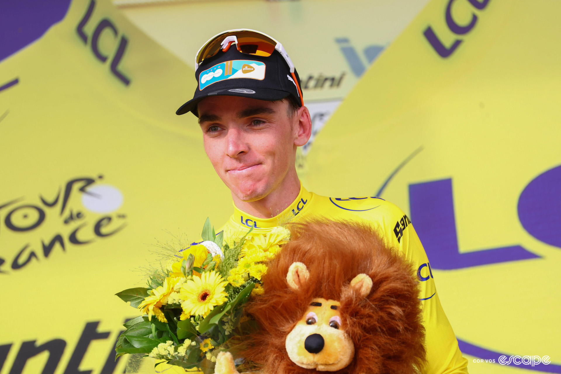 Romain Bardet wearing the yellow jersey on the podium after winning stage 1 of the 2024 Tour de France.