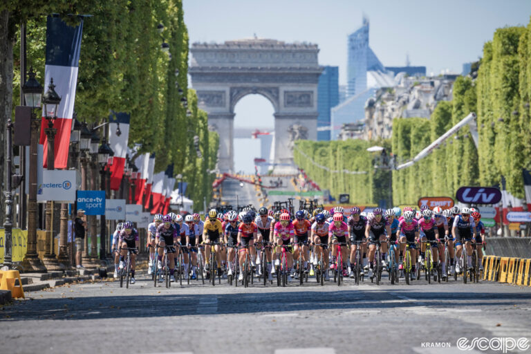 The women's peloton rides the Champs-Elysées during the opening stage of the 2022 Tour de France Femmes.