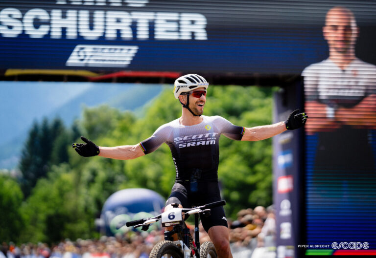 Nino Schurter celebrates victory at Cross Country World Cup Val di Sole.