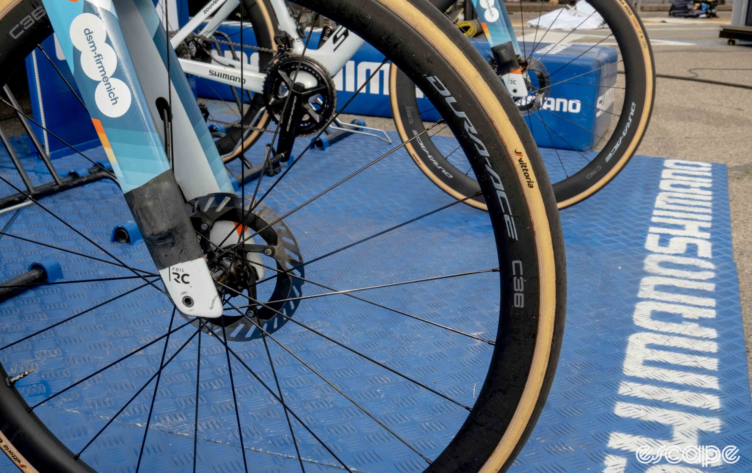 The photo shows Bardet's wheels with van den Broeck's in the background.