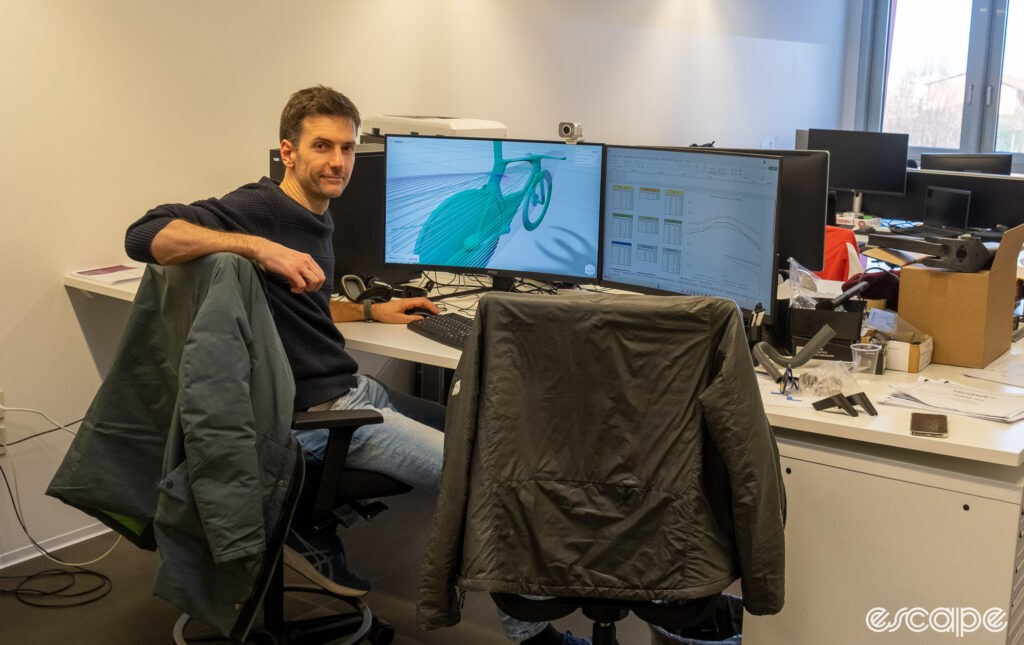 The image shows Marco Genovese at his design desk. 