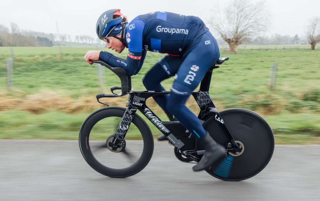 The image shows Stefan Kung testing the new bike in Belgium.