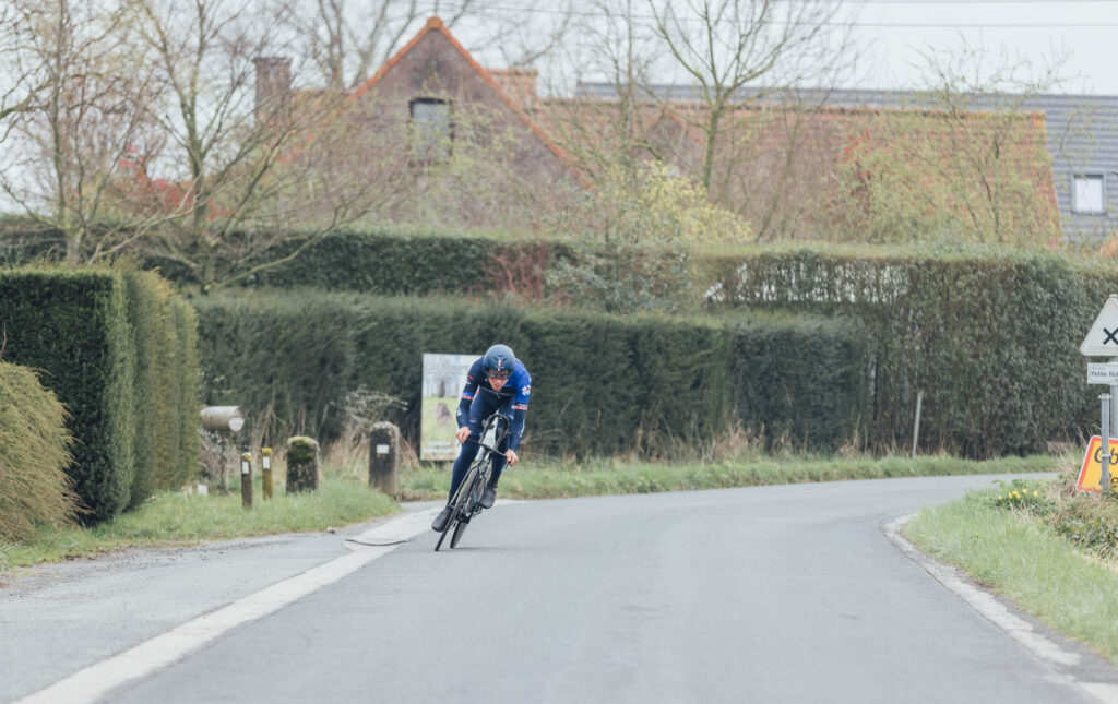 The photo shows Küng cornering fast on the time trial bike. 