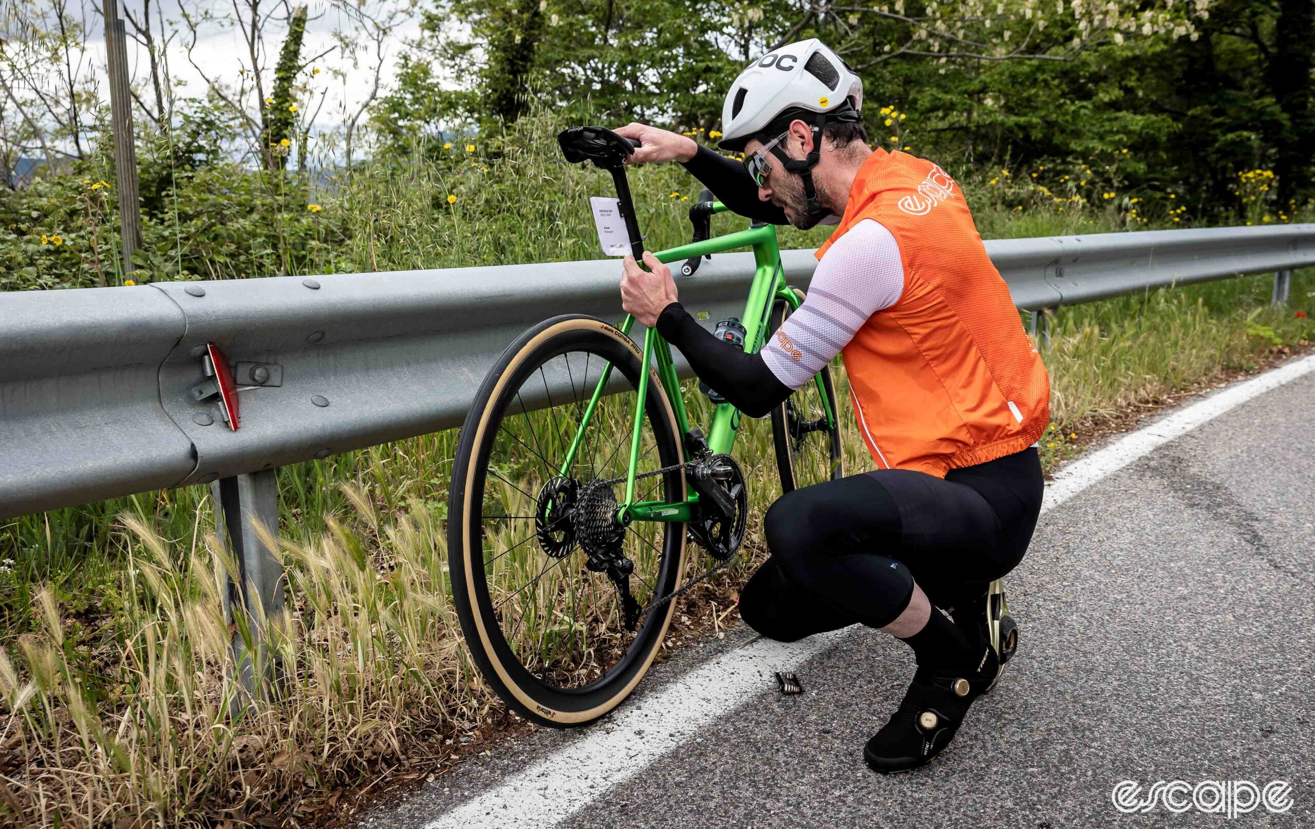 The photo shows Ronan adjusting his saddle height.