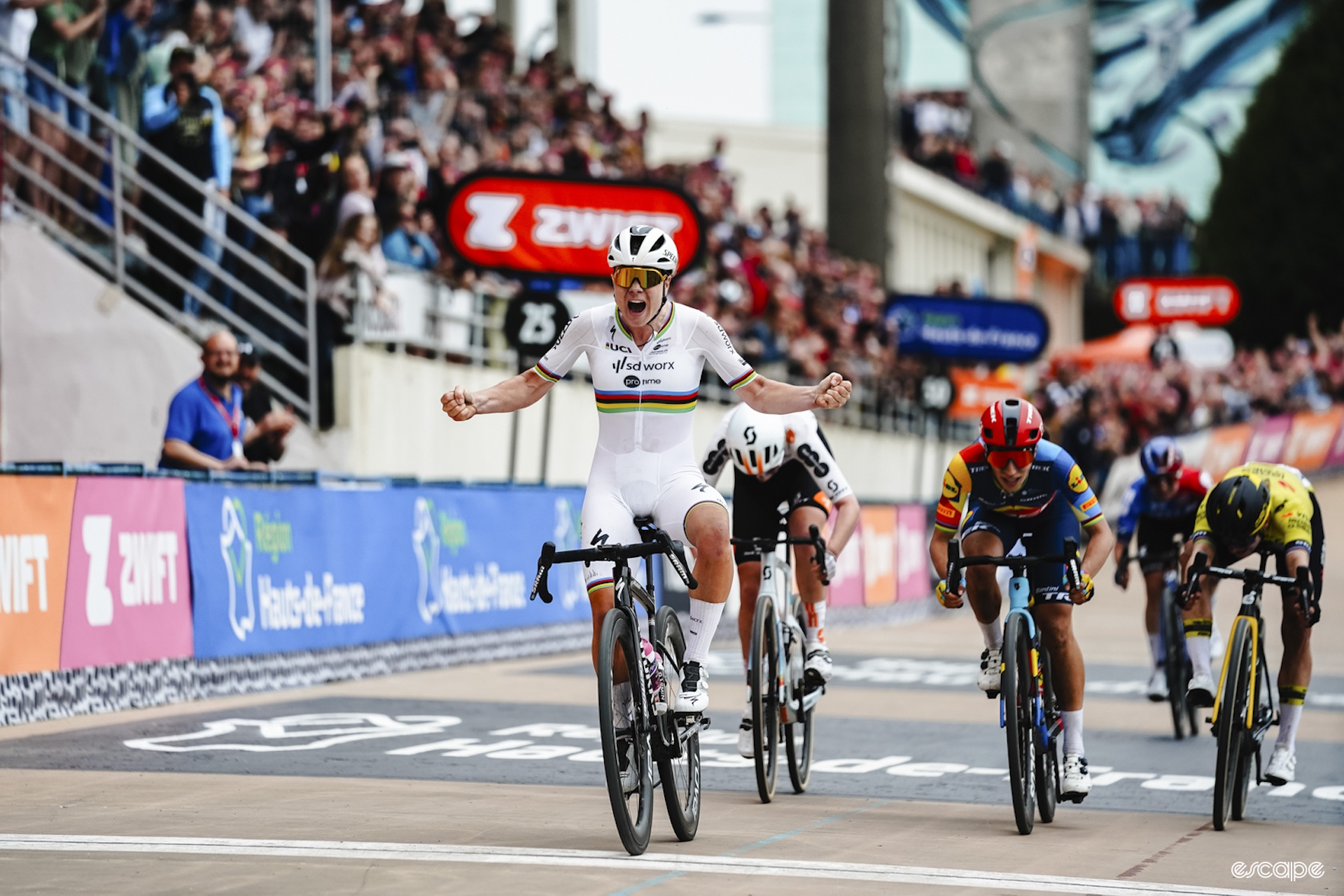 Kopecky flexes as she wins Paris Roubaix, Hulk style.