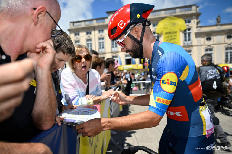 Julien Bernard takes a moment with fans to sign his autograph.