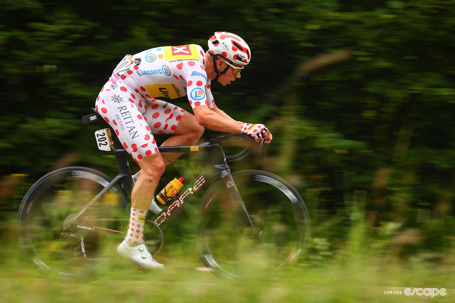 Jonas Abrahamsen, head to toe in the polka dots as mountains classification leader, during his lone breakaway on stage 8 of the 2024 Tour de France.