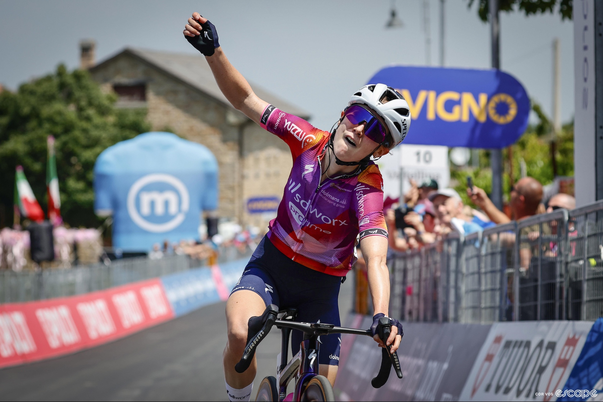 Niamh Fisher-Black raises her arm in victory