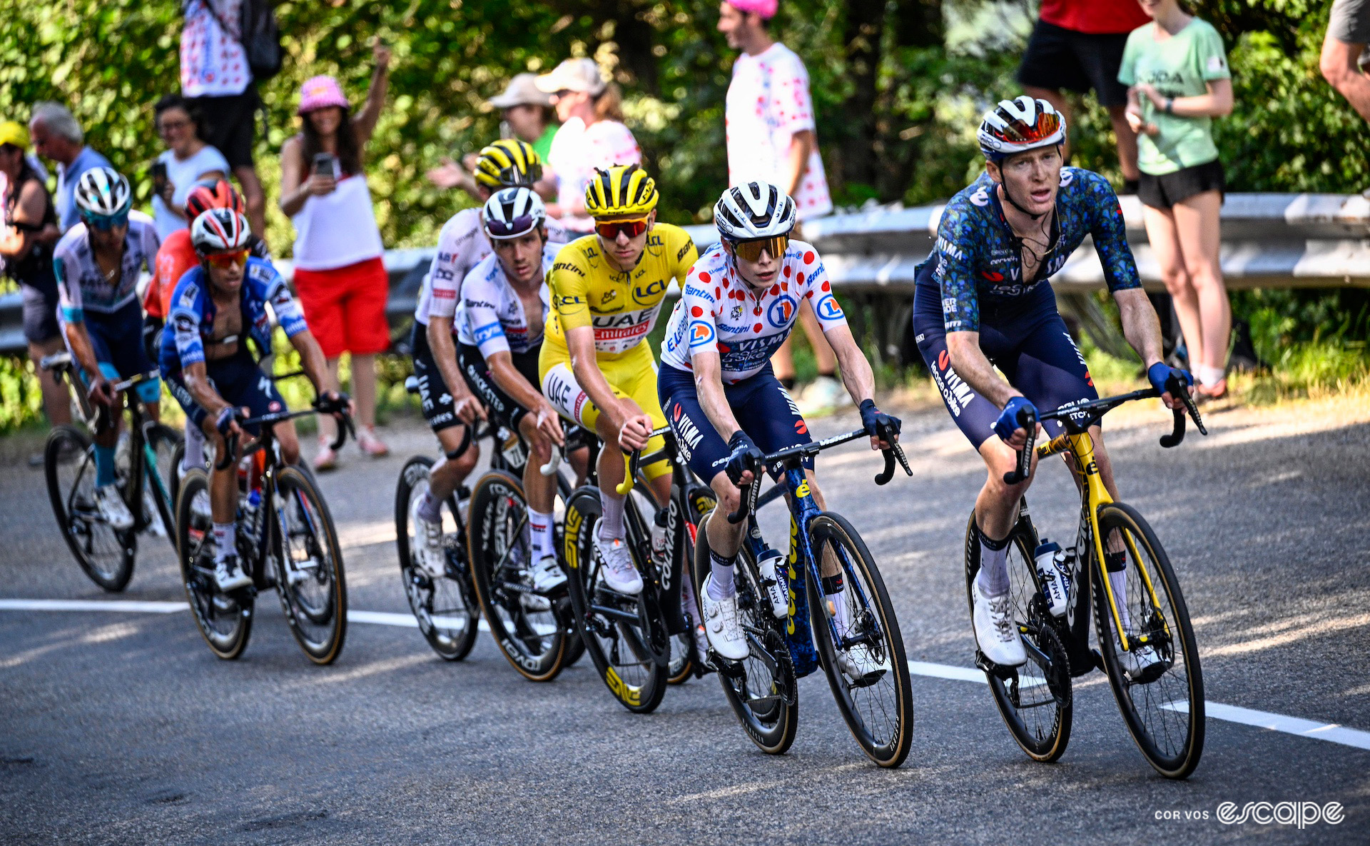 Matteo Jorgenson pulls the yellow jersey group with teammate Jonas Vingegaard in the polka-dot jersey on his wheel.