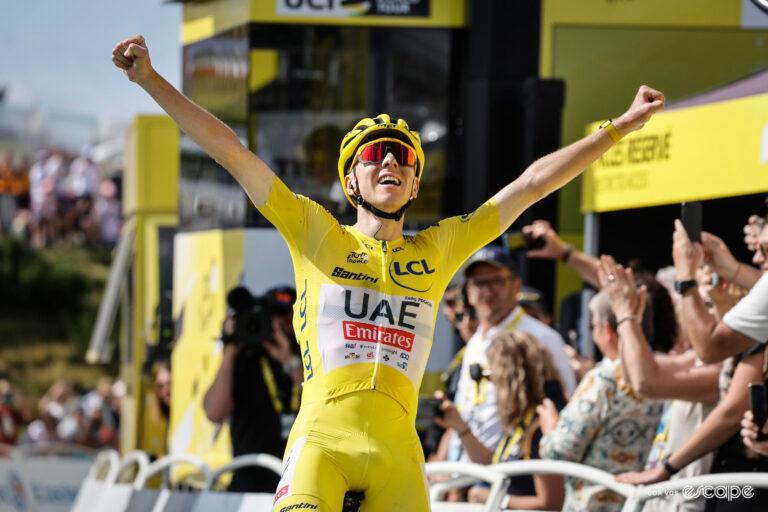 Tadej Pogačar celebrates stage 15 victory in the yellow jersey at the 2024 Tour de France.