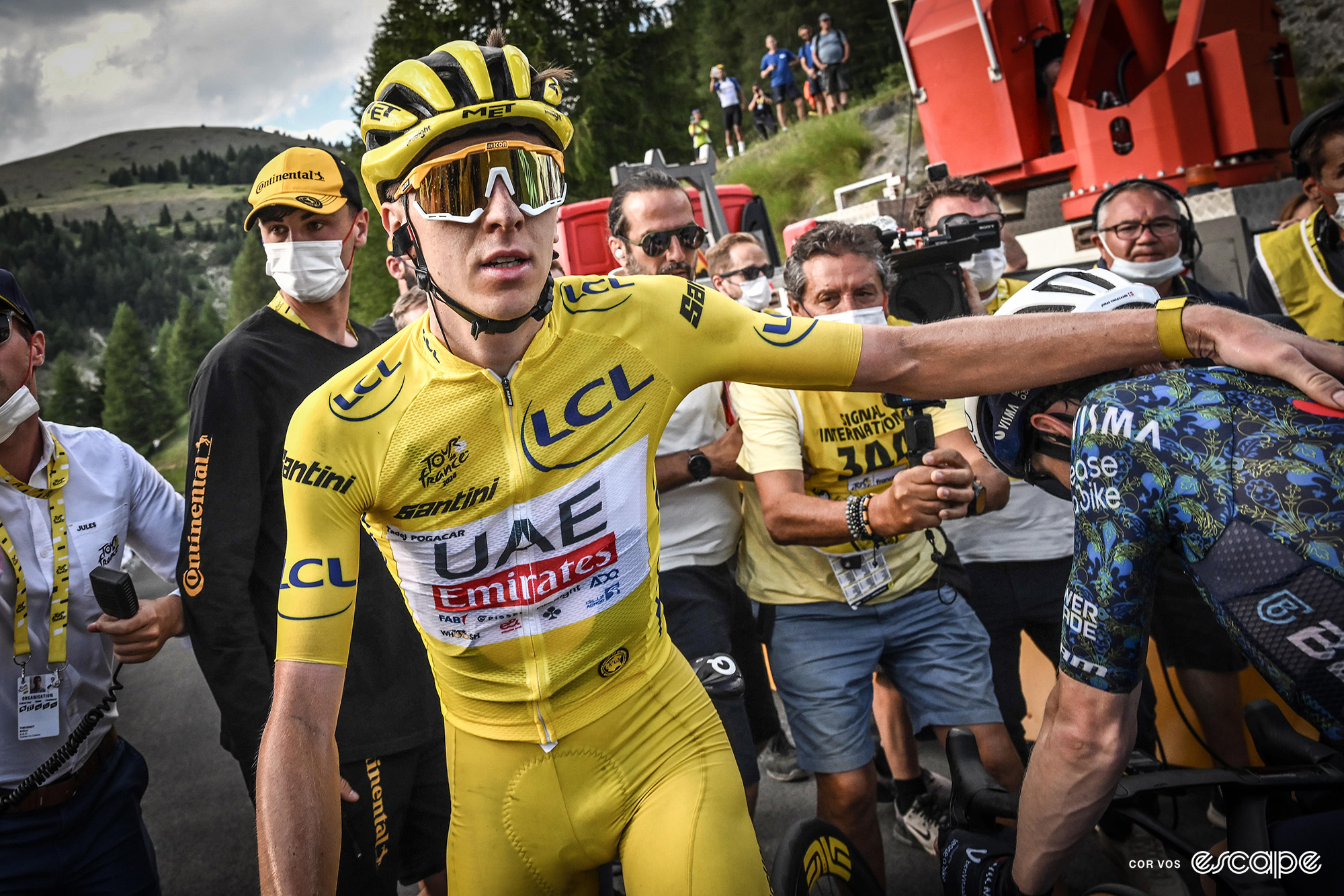 Tadej Pogačar pats Jonas Vingegaard on the back after stage 20 of the Tour de France.