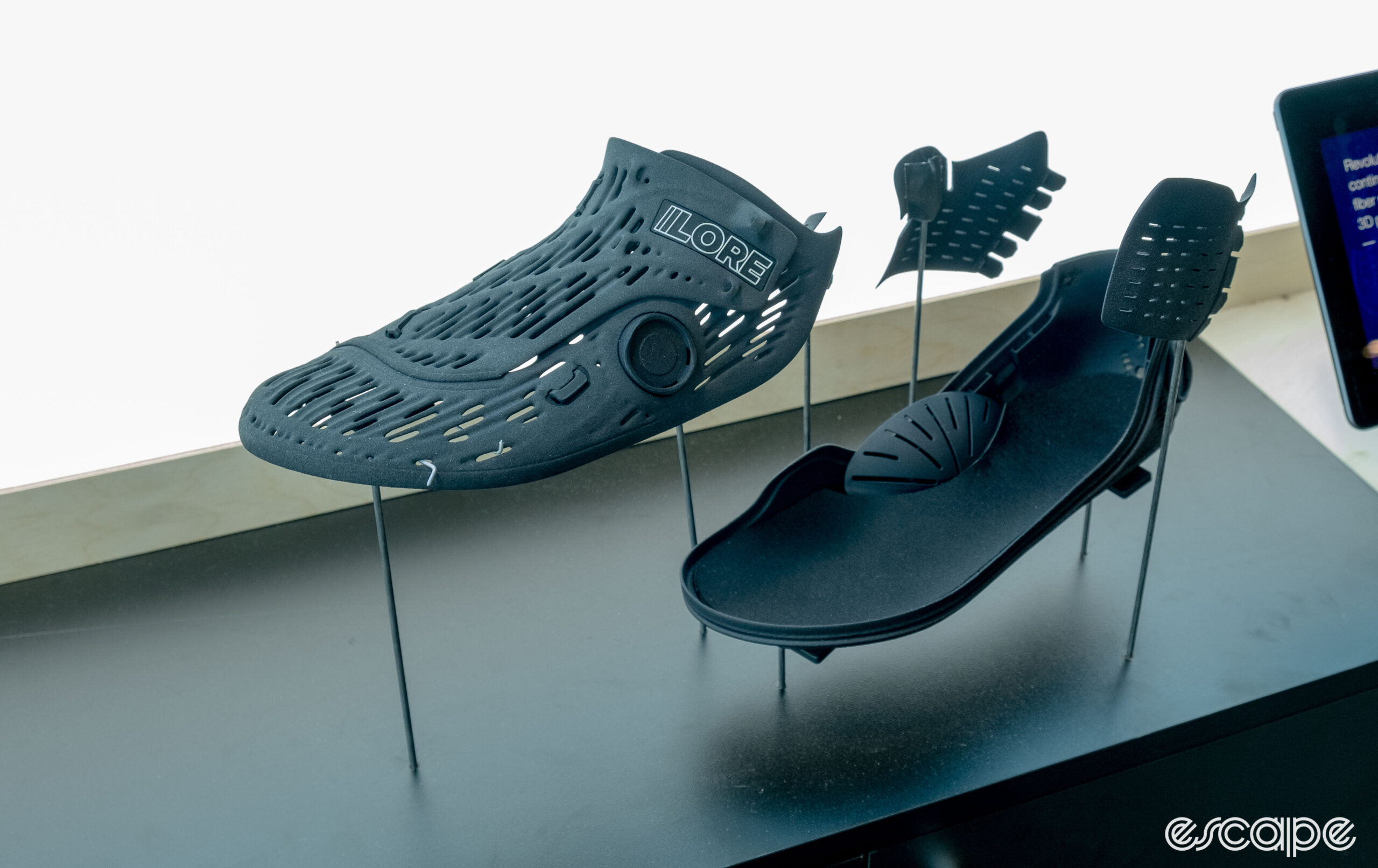 The photo shows the individual pieces of the LoreTwo 3d printed cycling shoes