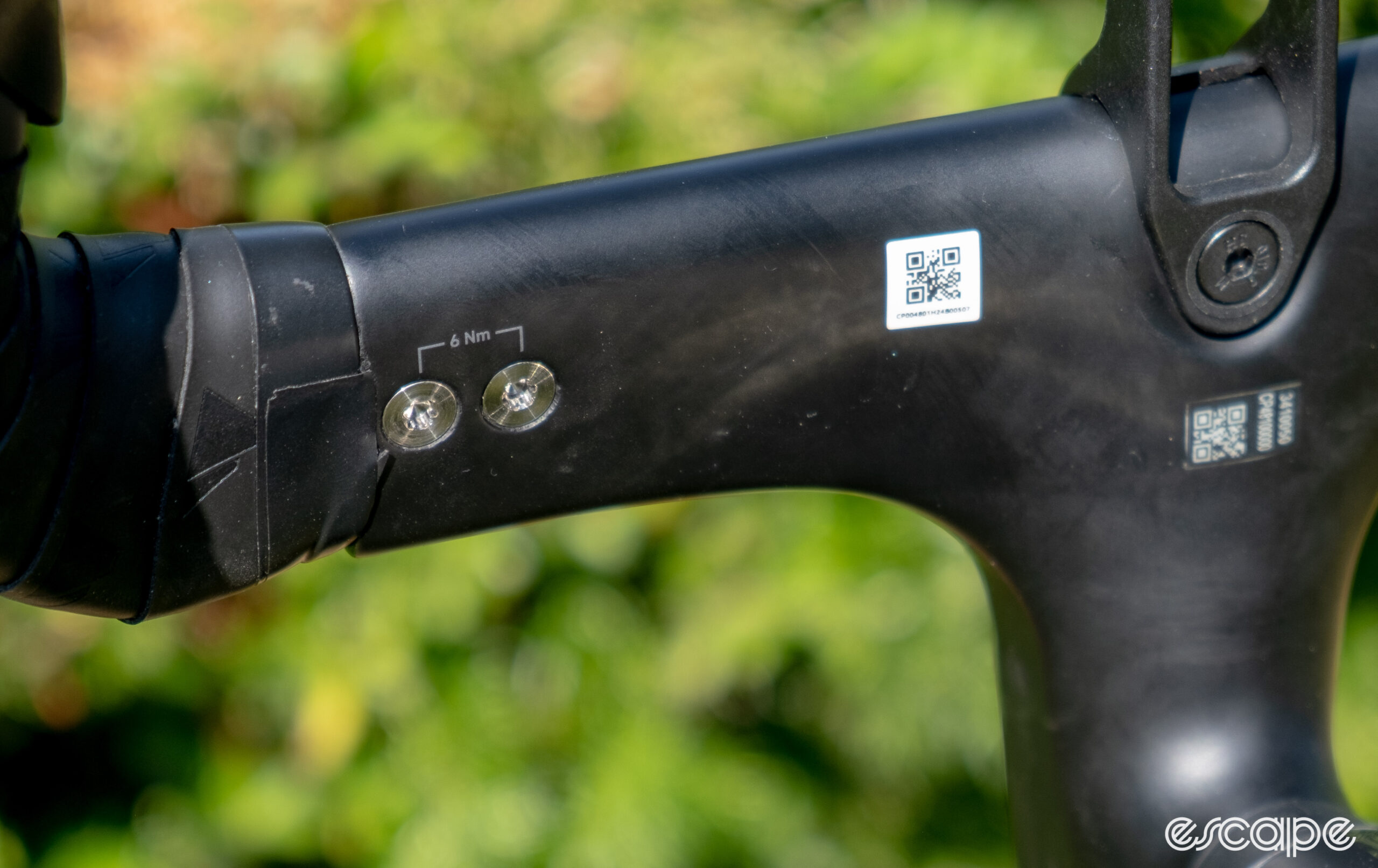 The photo shows the retaining bolts on Canyon's new PACE bar classic drops removed from the bike