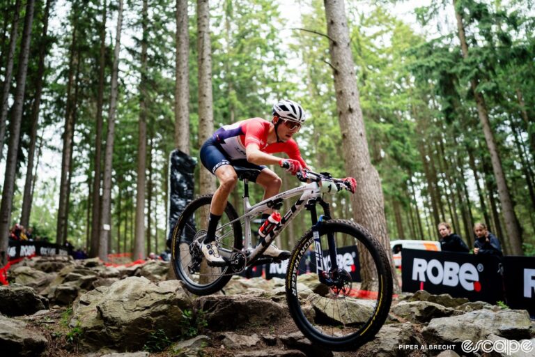 Riley Amos rides a rock garden descent at the 2024 Nove Mesto World Cup.