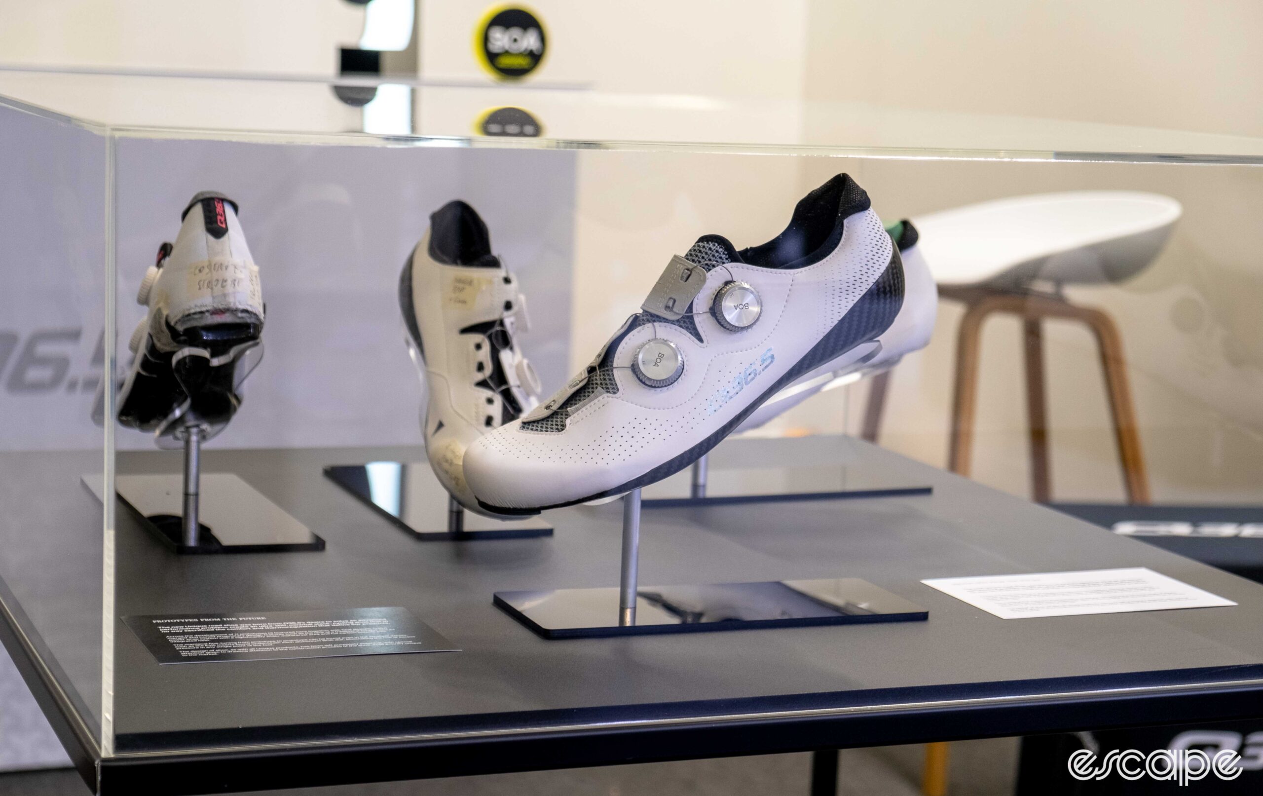 The photo shows the new q36.5 cycling shoes in a glass box.