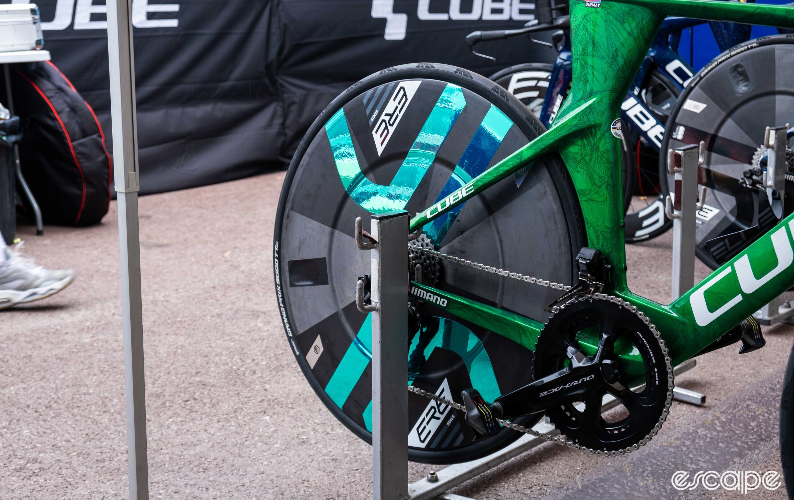 The image shows Biniam Girmay's green Cube Aerium C:68 TT bike with ERE Research rear disc wheel