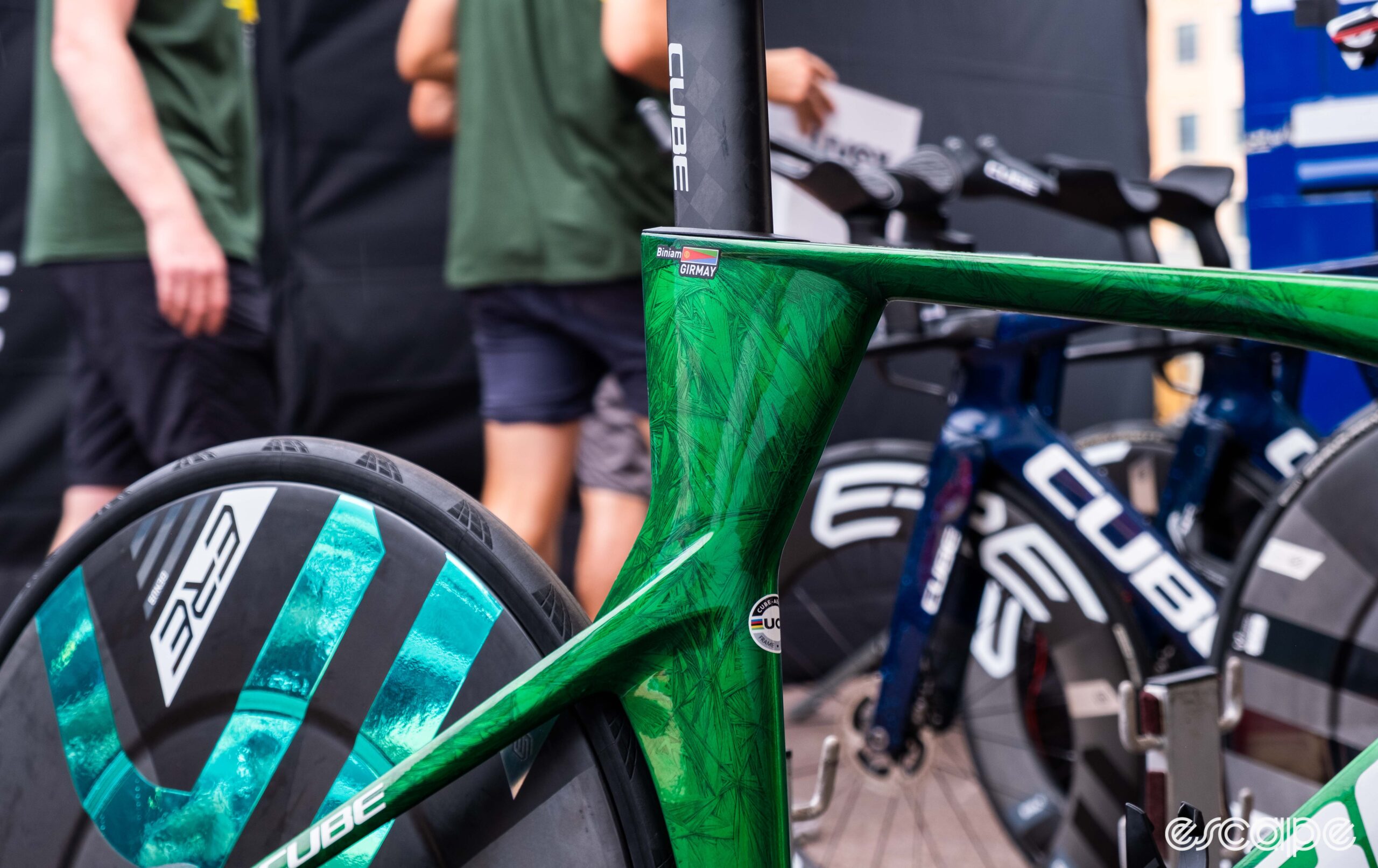 The image shows Biniam Girmay's green Cube Aerium C:68 TT bike seat tube