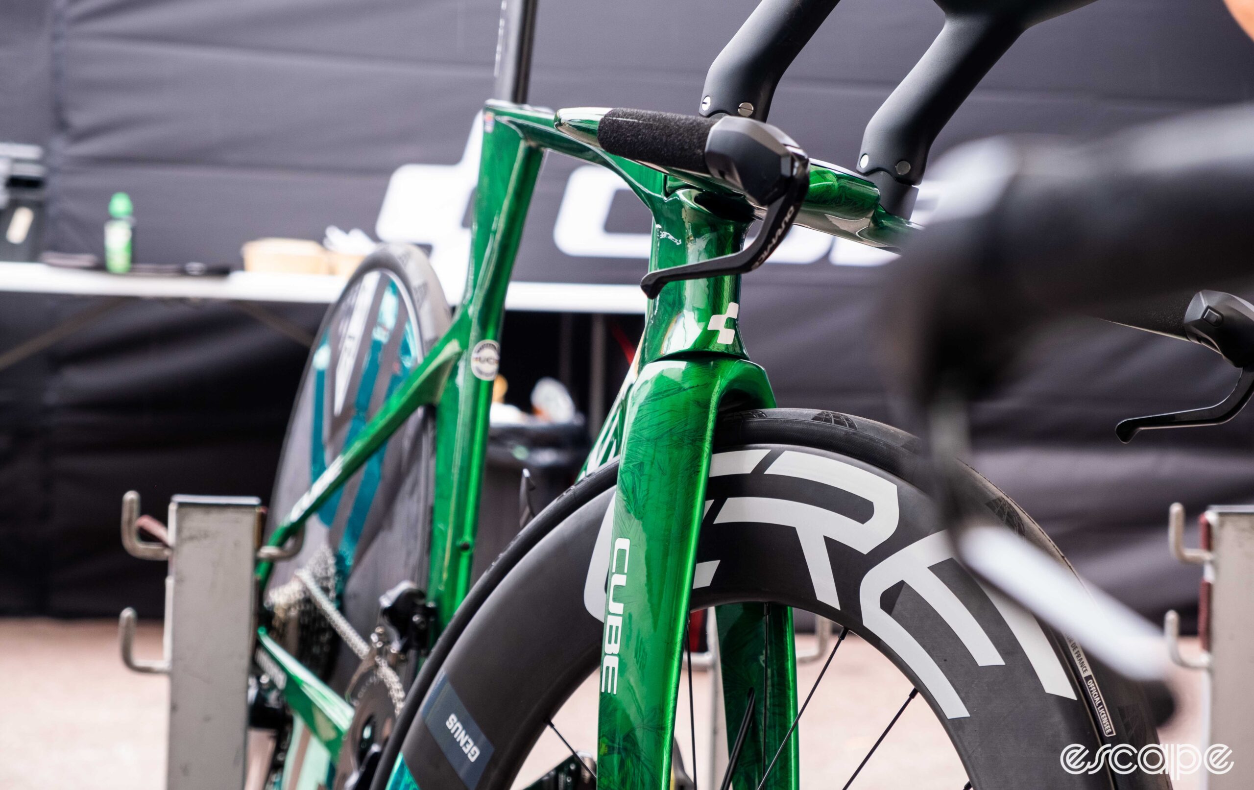 The image shows Biniam Girmay's green Cube Aerium C:68 TT bike forks and front end.