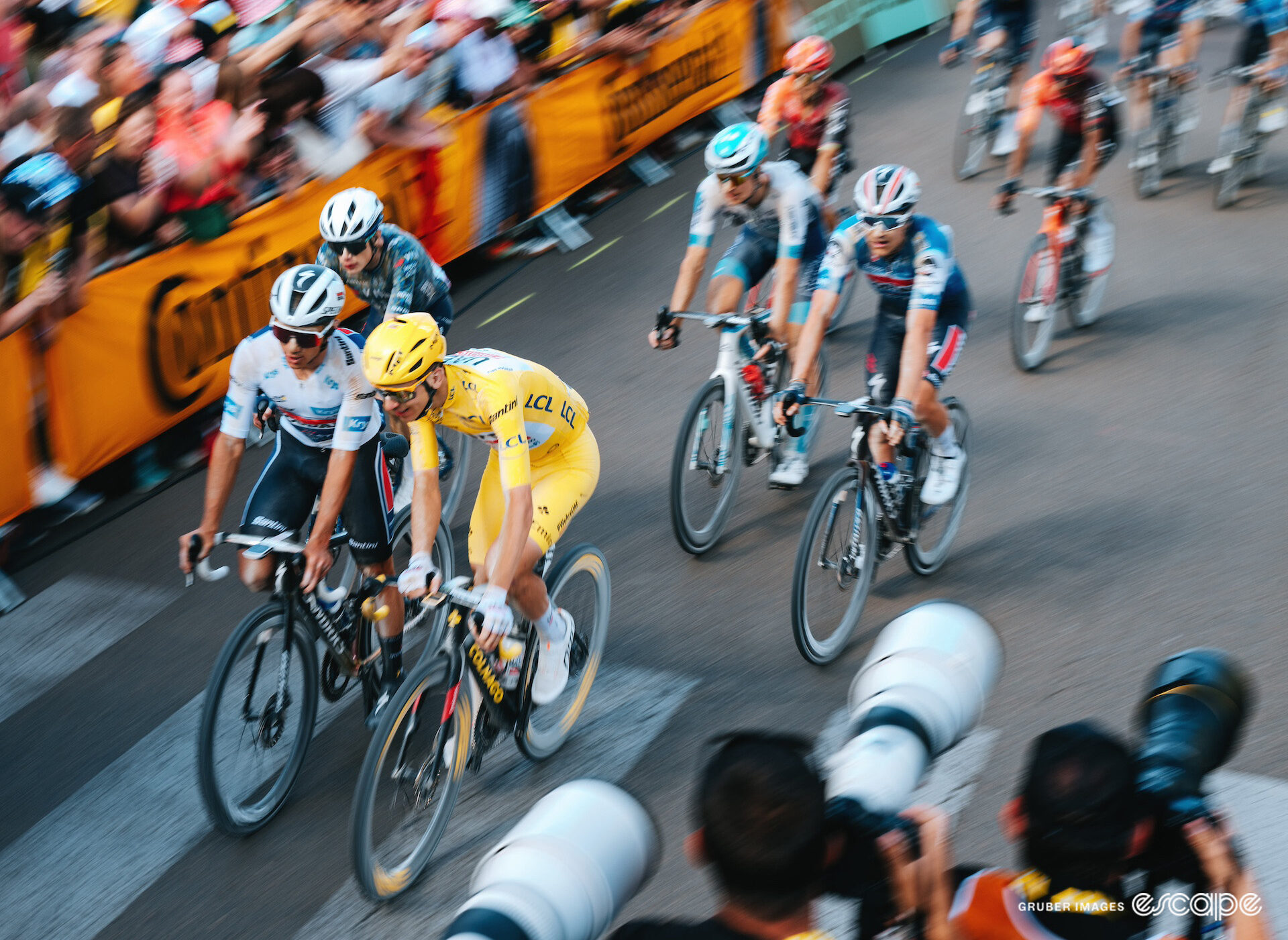 The relaxed GC group, led by Remco Evenepoel and Tadej Pogačar, crosses the line of stage 9 of the 2024 Tour de France.