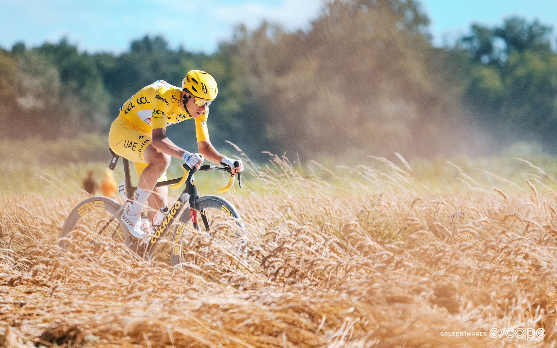 Tadej Pogačar on the attack in the yellow jersey during stage 9 of the 2024 Tour de France.