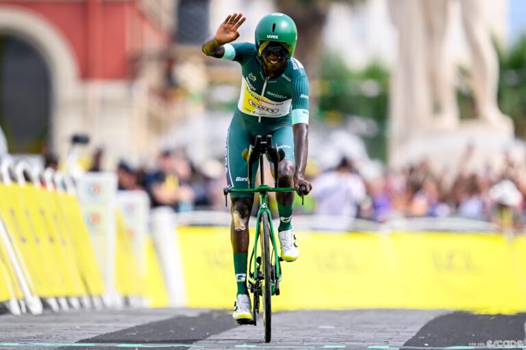 Biniam Girmay crosses the line in the Tour's final stage.