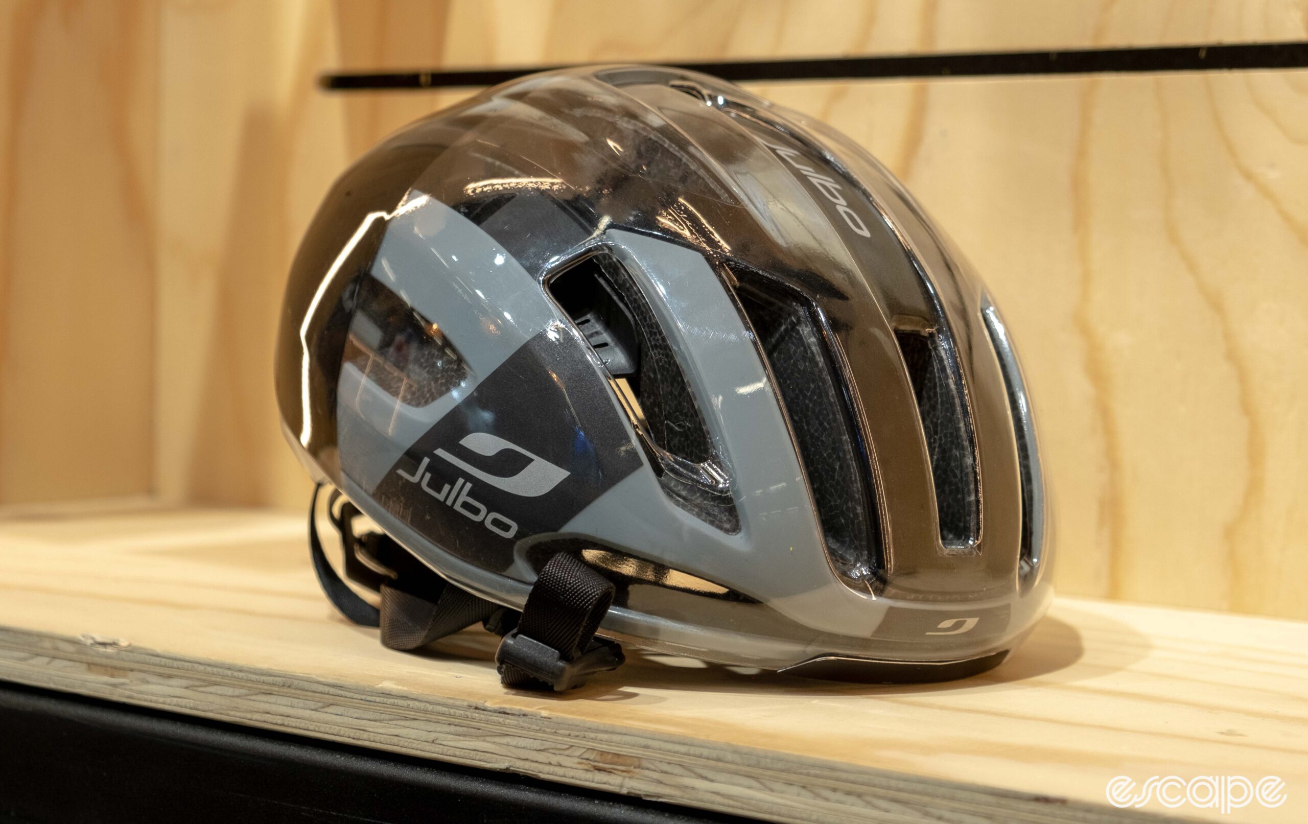 The photo shows Julbo Finisher Evo helmet in black with the cover