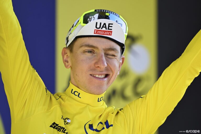 Tadej Pogačar on the podium after stage 18 of the Tour de France.