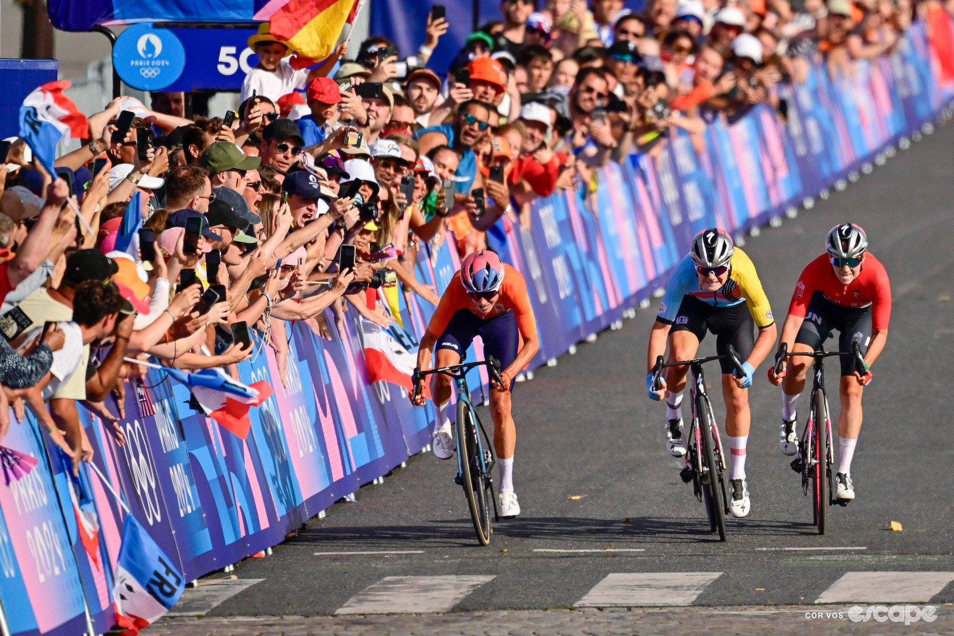 Marianne Vos, Lotte Kopecky and Blanka Vas sprint for second place in the road race at the 2024 Paris Olympics.